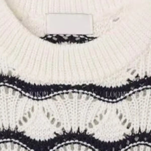 White Luxenk Wavy Stripe T-shirt featuring a stylish wavy stripe pattern, casual fit, and comfortable fabric.