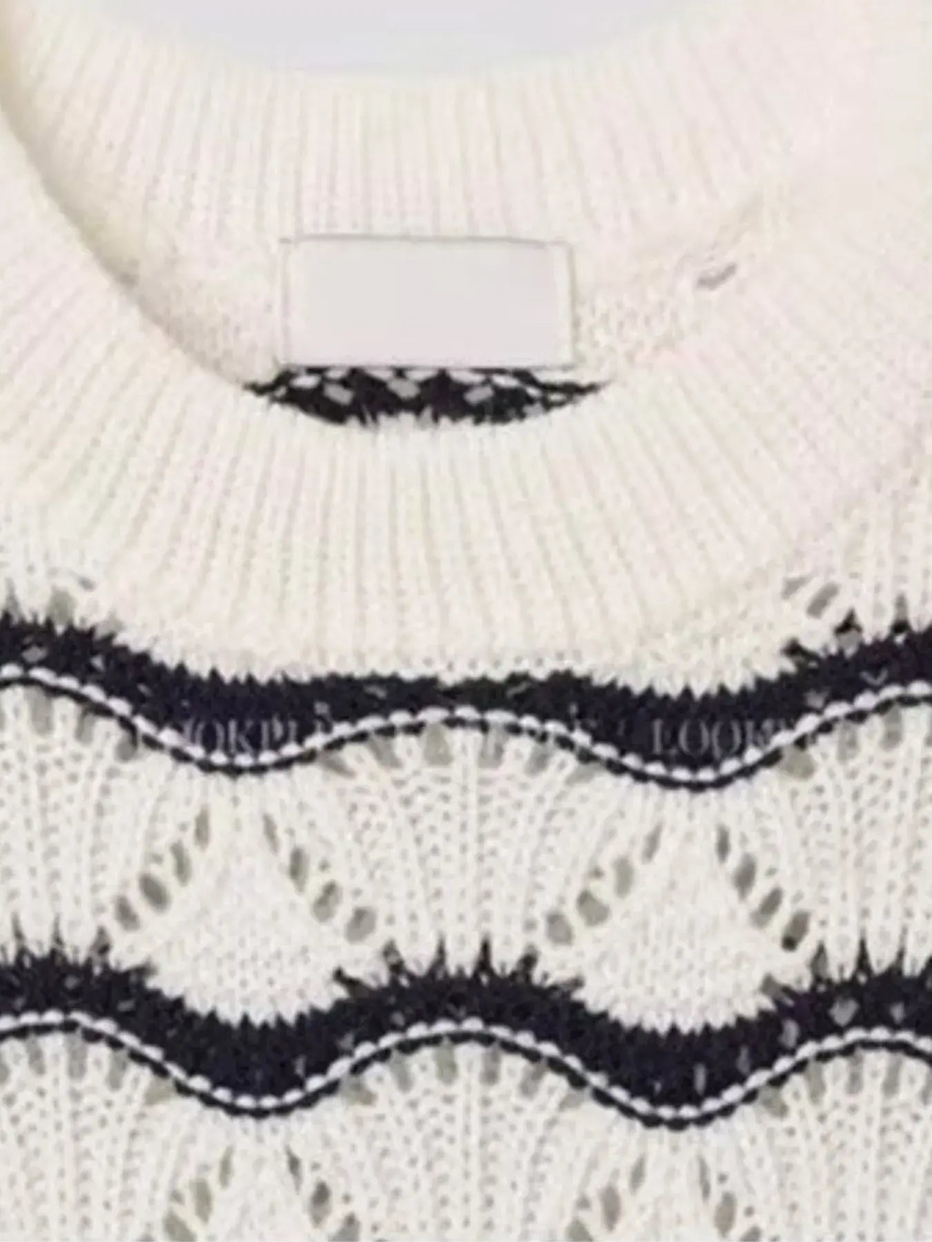 White Luxenk Wavy Stripe T-shirt featuring a stylish wavy stripe pattern, casual fit, and comfortable fabric.